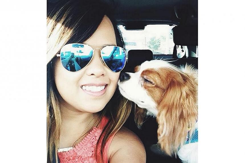 Texas health-care worker Nina Pham is pictured in a photo provided by her family. Pham, who became infected with Ebola while caring for a Liberian man who died of the illness, said on Tuesday that she is doing well, according to a hospital statement.