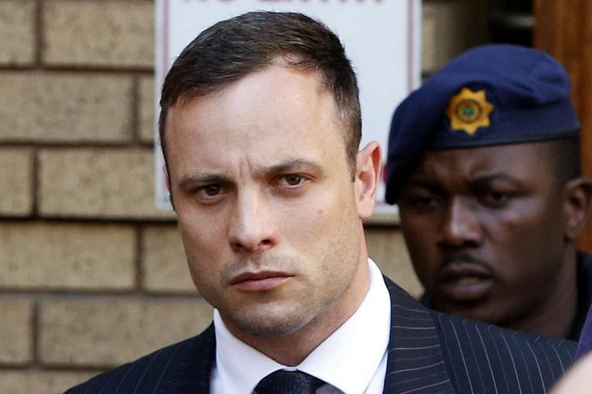 South African Olympic and Paralympic sprinter Oscar Pistorius leaves the North Gauteng High Court in Pretoria Oct 14, 2014. Pistorius returned to the court on Tuesday on the second day of sentencing procedures for the negligent killing of his model g