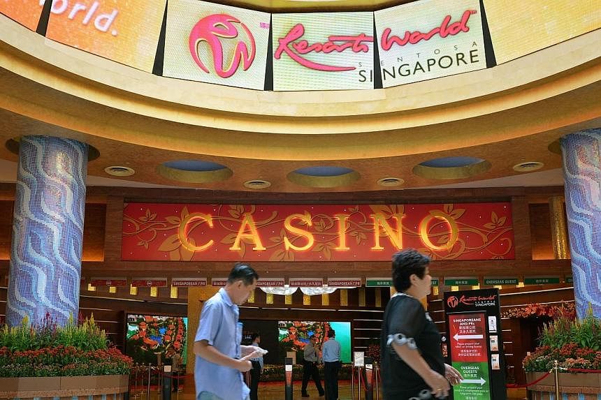 Shares in casino operator Genting Singapore, which operates Resorts World Sentosa, fell 2.8 per cent on Thursday after weakness in the high-rollers' business at rival Marina Bay Sands (MBS) stoked worries of poor results at the gaming firm. -- PHOTO:
