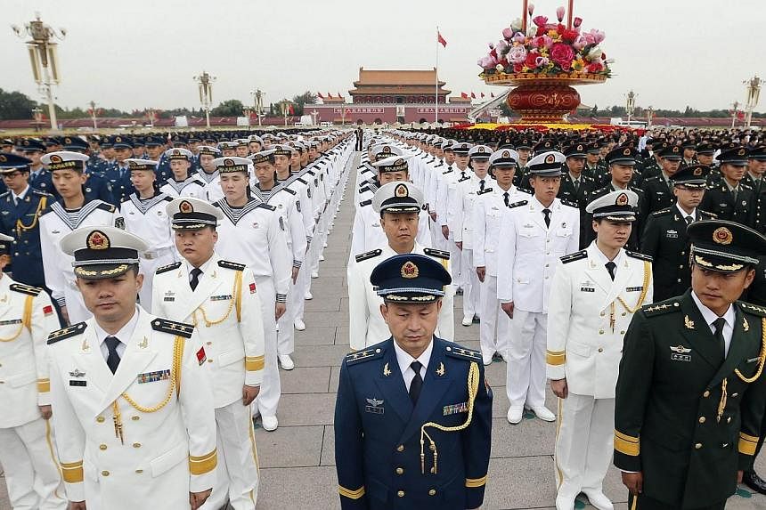 China will toughen audits of its military and target older officers to ensure that corrupt individuals are denied promotion and cannot get away with their crimes, the Defence Ministry said on Thursday. -- PHOTO: AFP