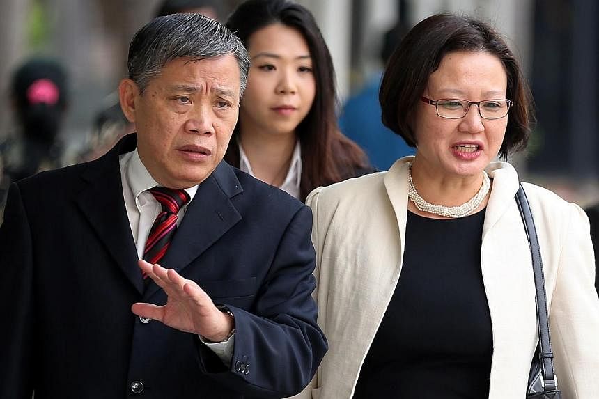 Aljunied-Hougang-Punggol East Town Council (AHPETC) chairman Sylvia Lim arriving at the State Courts with her lawyer Peter Low&nbsp;on Thursday.&nbsp;The trial to decide if the Workers' Party town council flouted the law in holding an unlicensed Chin