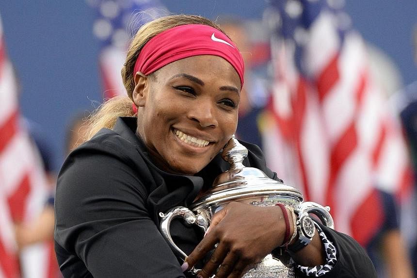 Serena Williams of the US holds the US Open trophy after defeating Caroline Wozniacki of Denmark during their US Open 2014 women's singles finals match at the USTA Billie Jean King National Center on Sept 7, 2014 in New York.&nbsp;Williams arrived in