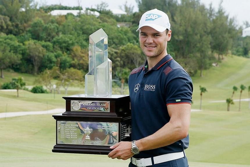 Martin Kaymer of Germany poses with the trophy after winning the PGA Grand Slam of Golf at Port Royal Golf Course on Oct 15, 2014 in Southampton, Bermuda. -- PHOTO: AFP&nbsp;