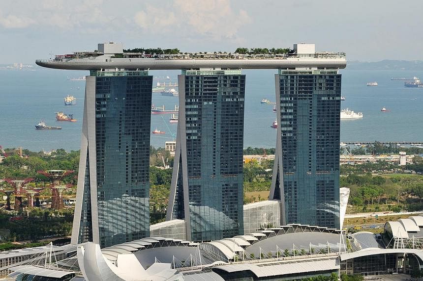 Marina Bay Sands posted profits of US$351.7 million for the third quarter ended Sept 30 as revenue from casino operations slowed due to weakness in the high-roller business. -- PHOTO: ST FILE