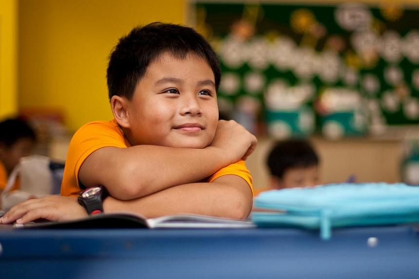 Despite having to spend close to 11 hours at Nan Hua Primary each schoolday, 10-year-old Vincent Qi has no complaints about the in-house after-school care arrangement. The Primary 4 pupil gets to play board games or soccer with his close friends in t