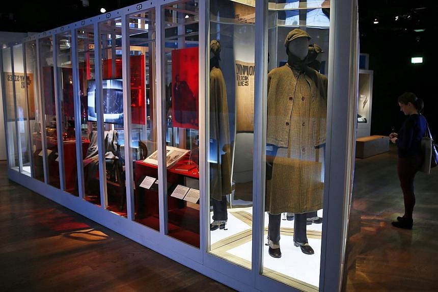 A great coat and a deerstalker hat from 1950 are displayed at the exhibition "Sherlock Holmes: The Man Who Never Lived and Will Never Die" at the Museum of London in London on Oct 16, 2014. -- PHOTO: REUTERS