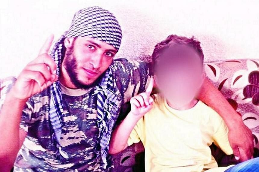 A picture of Erion Abazi (right) in Syria on social media with an unidentified man. The eight-year-old Kosovo boy, taken to Syria five months ago by his father who joined militants there, has been brought home after an intelligence operation, officia