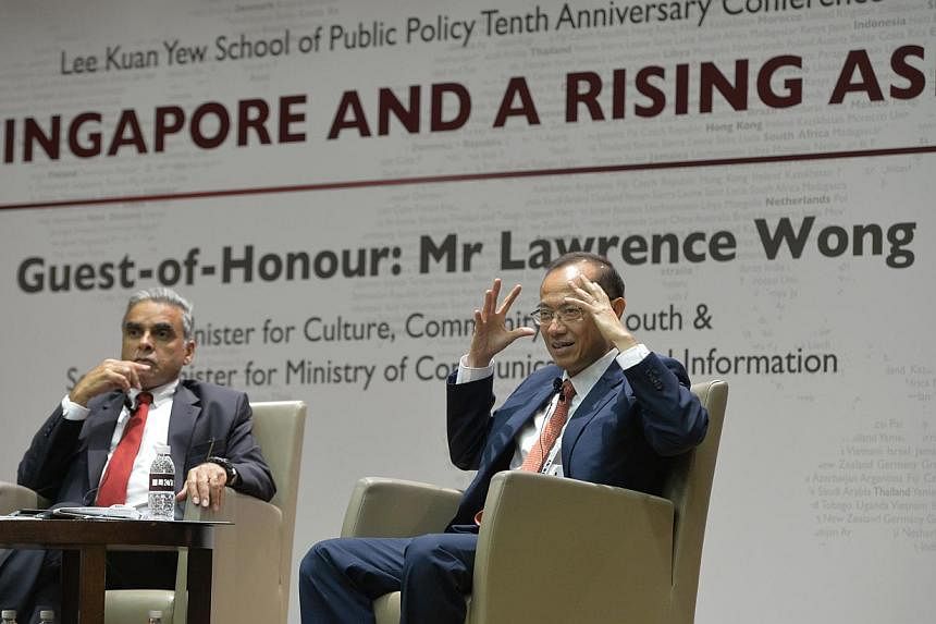 Former Minister George Yeo (right) holding a question and answer session moderated by LKYSPP dean Kishore Mahbubani after delivering his key note speech at the Lee Kuan Yew School of Public Policy's 10th anniversary conference. -- ST PHOTO: DESMOND F
