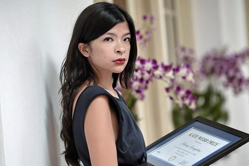 Multimedia journalist Patricia Evangelista received the 2014 Kate Webb Prize from Agence France-Presse on Friday for her compelling reporting on conflict and disaster in her native Philippines. -- PHOTO: AFP
