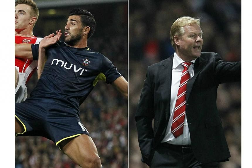 Southampton manager Ronald Koeman (right) and their striker Graziano Pelle (left in blue) were named on Friday the Manager and Player of the Month for September after the club's bright start to the season. -- PHOTO: AFP
