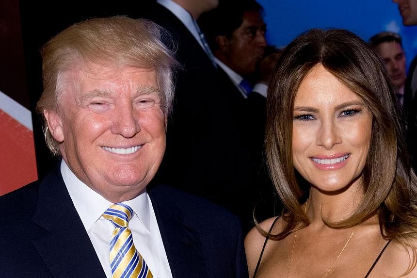 Donald Trump and Melania Trump attend the US Ryder Cup Captain's Picks News Conference on Sept 2, 2014 in New York City. Tycoon Donald Trump is personally liable for operating a for-profit investment school without the required licence, a New York ju