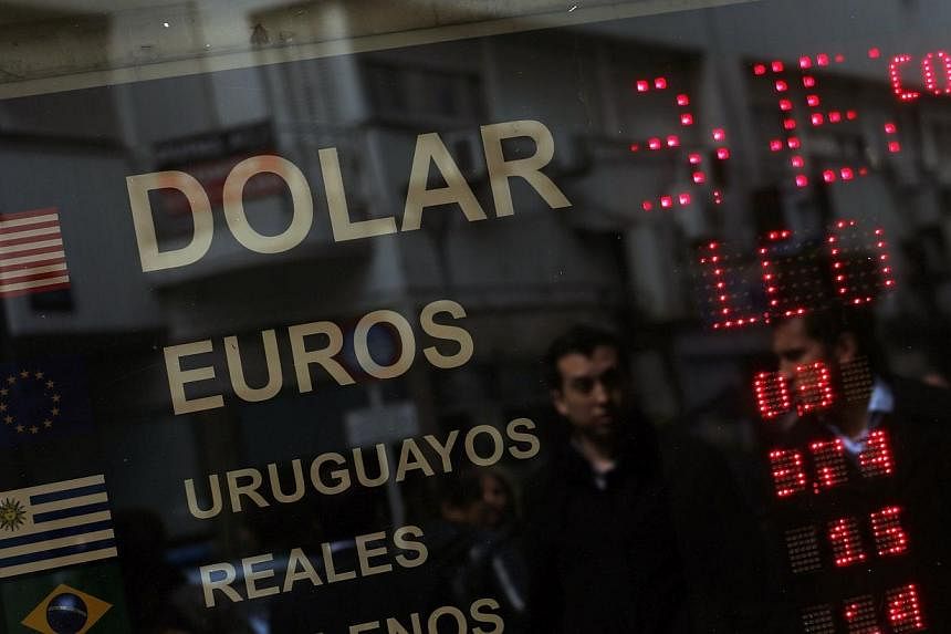 Argentina will launch a new two-year sovereign bond on Oct 23 for up to US$1 billion, denominated in US dollars and paid in the local peso currency, the Economy Ministry said in a statement on Friday. -- PHOTO: REUTERS