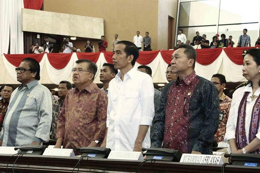 This handout picture released by the House of Representative (MPR) on Oct 18, 2014, shows President-elect Joko Widodo (centre) and Vice-President elect Jusuf Kalla (second, left) accompanied by house speaker, Mr Zulkifli Hassan (second, right), House