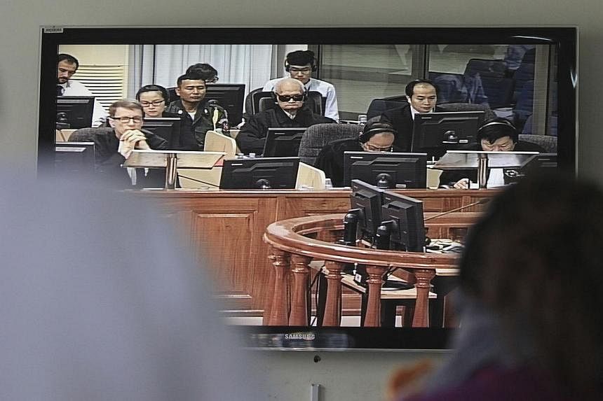 Former Khmer Rouge national assembly chief Nuon Chea, known as 'Brother Number Two', is seen on a television screen in the media room at the Extraordinary Chambers in the Courts of Cambodia (ECCC) during his trial on the outskirts of Phnom Penh on Oc