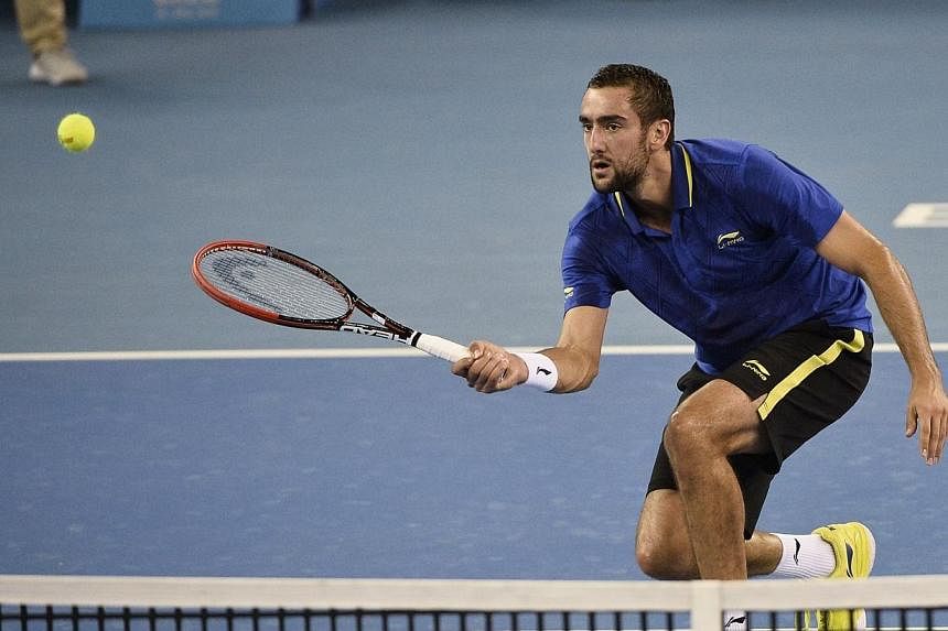 Marin Cilic of Croatia returns a shot against Joao Sousa of Portugal during men's singles second round match at the China Open tennis tournament in the National Tennis Center of Beijing on Oct 2, 2014. -- PHOTO: AFP