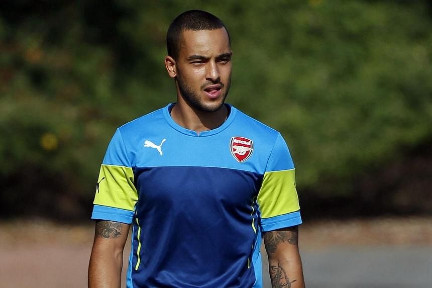 Arsenal's Theo Walcott arrives for a training session at their training facility in London Colney, north of London on Sept 30, 2014.&nbsp;Arsenal winger Theo Walcott played 45 minutes for the club's Under-21 side against Blackburn on Friday as he fin