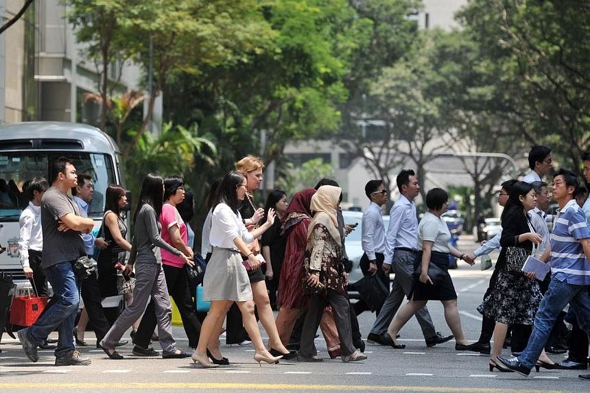 Singapore's policy of slowing the increase in foreign workers could hurt the country's potential growth and lower its competitiveness, the International Monetary Fund (IMF) said in a report issued late Friday. -- PHOTO: ST FILE