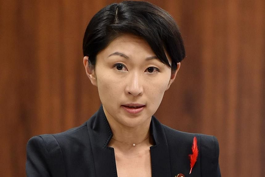 Japan's Economy, Trade and Industry Minister Yuko Obuchi answers questions during a committee session of economy, trade and industry of the House of Councilors at the Parliament in Tokyo on Oct 16, 2014. -- PHOTO: AFP