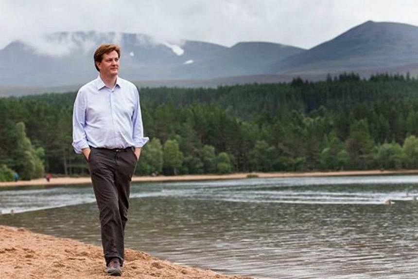 British MP Danny Alexander, who posted a photograph of himself walking along a beach in an open-neck shirt and minus glasses on his Facebook page, has become the subject of ridicule on social media after a series of hilarious memes started making the