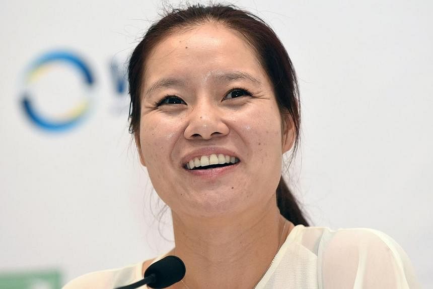 Li Na of China attends a press conference ahead of the Women's Tennis Association (WTA) championships in Singapore on Oct 19, 2014.&nbsp;-- PHOTO: AFP