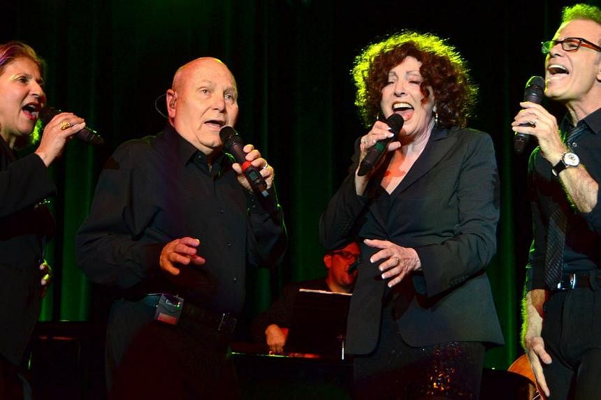 The Manhattan Transfer (Tim Hauser second from left) perform at the San Manuel Amphitheater on April 24, 2014, in San Bernadino, California. Hauser, who founded the Grammy-winning pop-jazz vocal group,&nbsp;died last Thursday in Sayre, Pennsylvania, 