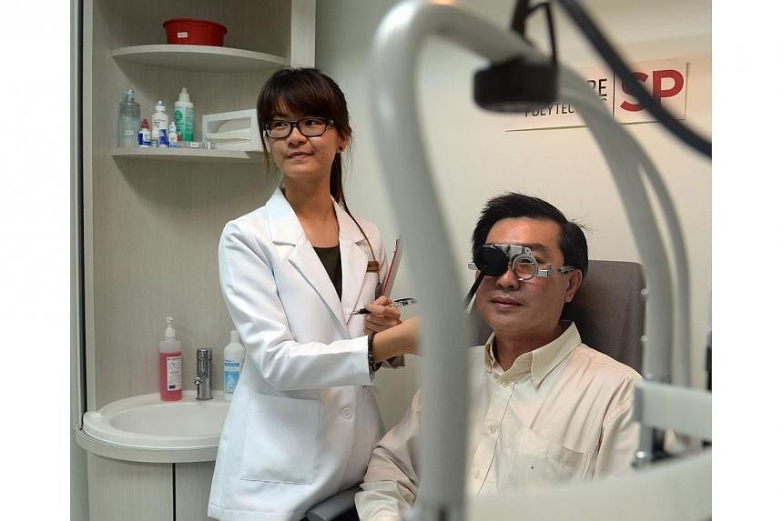 Taxi driver Henry Tay, 44, getting a free eye screening from Ms Khai Siu, 20, a student clinician with Singapore Polytechnic (SP).&nbsp;Close to &nbsp;2,000 cabbies will get free eye checks and half-priced spectacles &nbsp;from Oct 20 &nbsp;till Dec 