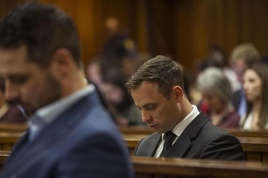 Olympic and Paralympic track star Oscar Pistorius attends his sentencing hearing at the North Gauteng High Court in Pretoria on Oct 17, 2014. The&nbsp;South African fallen star could be jailed for 10 years or return to serve house arrest on Tuesday w