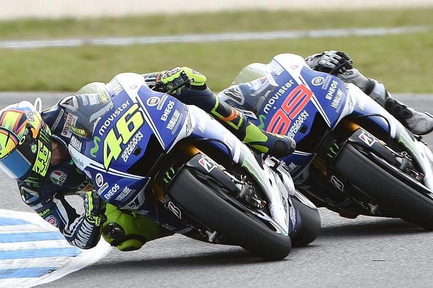 MotoGP rider Valentino Rossi of Italy leads team mate Jorge Lorenzo of Spain (right) during the Australian MotoGP Grand Prix at Phillip Island on Oct 19, 2014.&nbsp;Valentino Rossi holds the edge over his Yamaha team-mate Jorge Lorenzo in the battle 