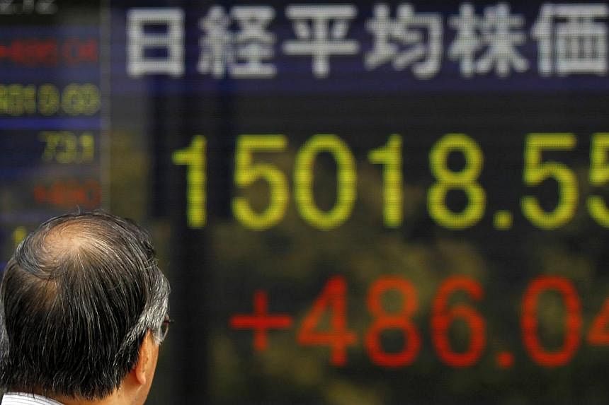 Tokyo stocks jumped 3.98 per cent by the market's close on Monday, following sharp gains on Wall Street and as a weaker yen boosted exporters' shares. -- PHOTO: REUTERS