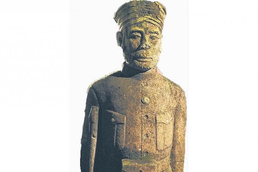 One of the many Sikh guard tombstone statues found at Bukit Brown. -- PHOTO: LIM YAOHUI FOR THE STRAITS TIMES