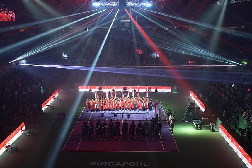 The BNP Paribas Women's Tennis Association (WTA) Finals got off to a bright start at the Singapore Indoor Stadium in an opening ceremony marked by a dazzling light display and live performances. -- ST PHOTO: CAROLINE CHIA