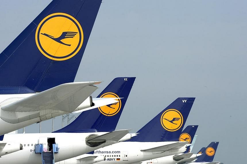 Picture taken on Sept 10, 2014 shows aircrafts of German airline Lufthansa standing at the park position at the Franz-Josef-Strauss-Airport in Munich, southern Germany, during a strike of pilots. -- PHOTO: AFP
