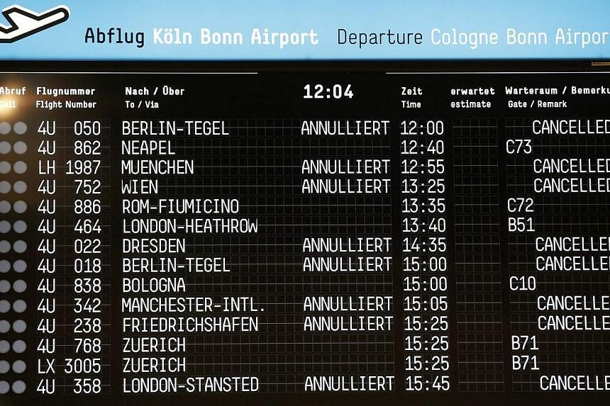 An electronic information board shows cancelled flights at Cologne-Bonn airport on Oct 16, 2014. -- PHOTO: REUTERS