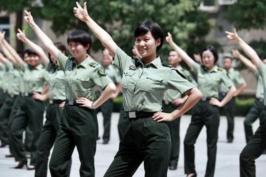 Soldiers dance to the popular song Little Apple in Xi'an, Shaanxi province, in this file picture.&nbsp;-- PHOTO: CHINA DAILY / ASIA NEWS NETWORK