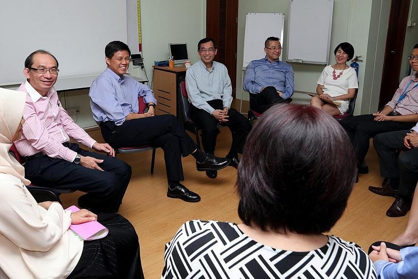 Minister for Social and Family Development, Mr Chan Chun Sing (third left, in blue) visiting Fei Yue Family Service Centre (Yew Tee) on Monday. Mr Chan announced a new marriage preparation programme tailored specially for Singaporeans who are marryin
