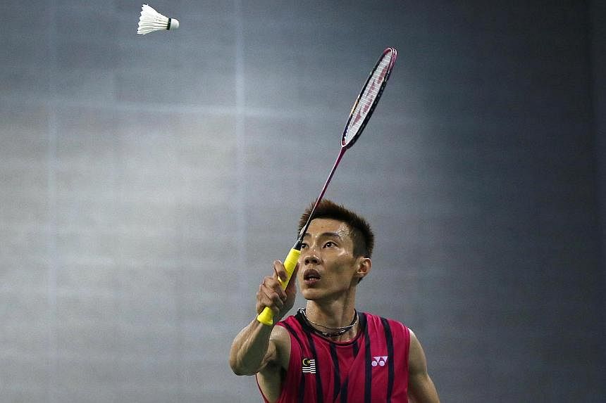 Malaysia's Lee Chong Wei returns a shot against China's Lin Dan during the men's singles semi-final badminton match at Gyeyang Gymnasium at the 17th Asian Games in Incheon on Sept 28, 2014.&nbsp;-- PHOTO: REUTERS