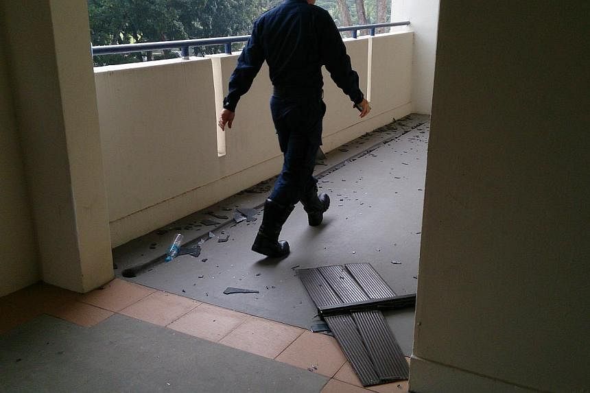A suspected gas explosion this morning at a flat in Ang Mo Kio caused a window grille to be dislodged.&nbsp;-- ST PHOTO: DESMOND FOO