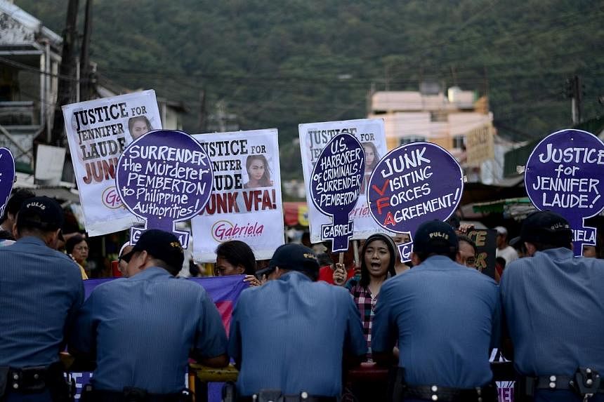 Supporters of murdered Filipino transgender Jeffrey Laude, also known as "Jennifer", hold a protest near the Hall of Justice where the preliminary hearing for the murder case is being held at the northern Philippine city of Olongapo on Oct 10, 2014.&