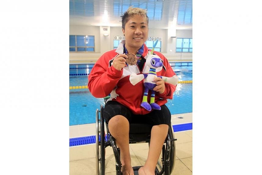 Team Singapore para-swimmer Theresa Goh after winning her first bronze medal in the womens 100m breast stroke finals on Day 1 of the Asian Para Games 2014.&nbsp;Swimmer Theresa Goh has won her second bronze at the Asian Para Games after finishing t