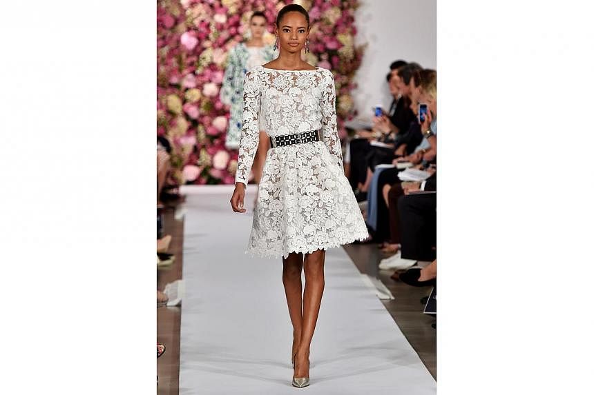 A model walks the runway at the Oscar De La Renta fashion show during Mercedes-Benz Fashion Week Spring 2015 on Sept 9, 2014, in New York City. -- PHOTO: AFP