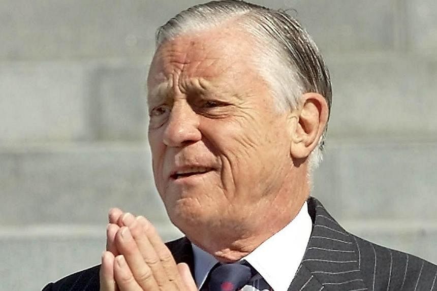 A 2001 photo of former Washington Post Executive Editor Ben Bradlee arriving at the Washington National Cathedral to attend the funeral service for former Post chairman Katharine Graham in Washington, DC. Bradlee, who oversaw the paper's coverage of 