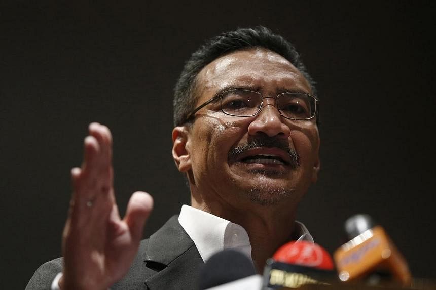 Malaysia's Defence Minister Hishammuddin Hussein speaks at a news conference about the investigation into the Malaysia Airlines Flight MH17 plane crash, on his return from Ukraine, in Kuala Lumpur on Sept 12, 2014.&nbsp;-- PHOTO: REUTERS