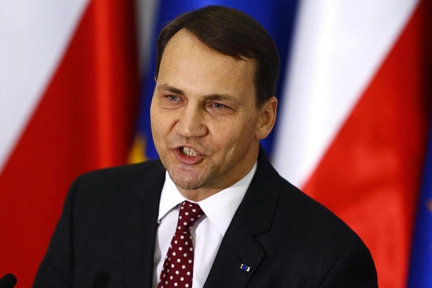 Poland's parliamentary speaker Radoslaw Sikorski speaks during a media conference at the parliament in Warsaw on Oct 21, 2014. -- PHOTO: REUTERS