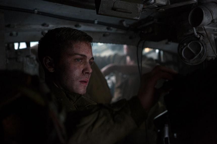 Actor Logan Lerman (left) plays a greenhorn assistant tank driver in Fury.