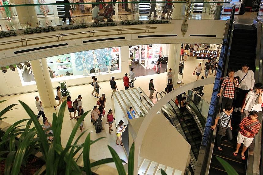 Shoppers seen inside Raffles City Shopping Centre on 2012. -- PHOTO: ST FILE