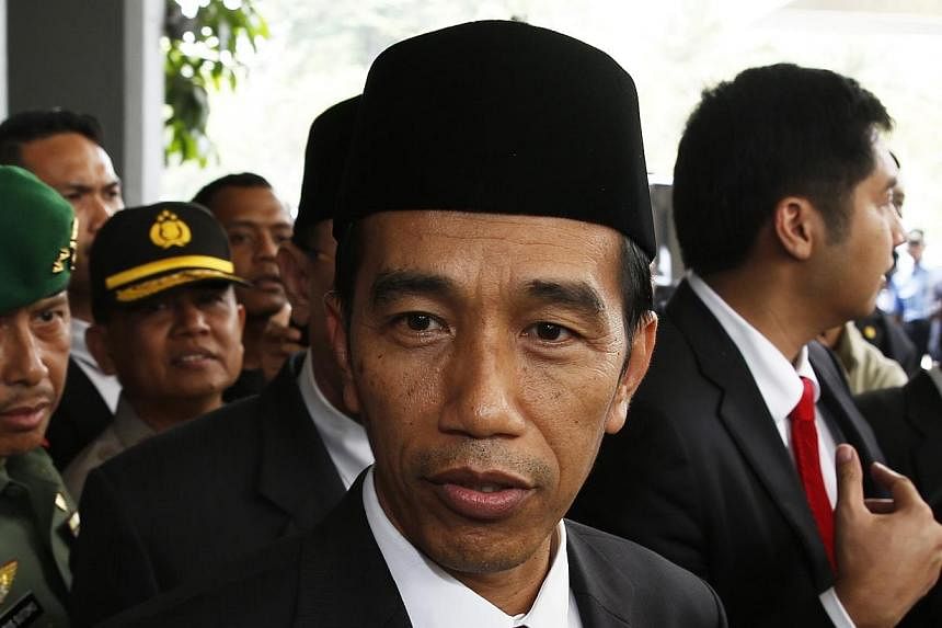 Indonesia's President-elect Joko Widodo looks on after a ceremony inaugurating a new parliament in Jakarta, Oct 1, 2014.&nbsp;Indonesian President Joko "Jokowi" Widodo has finalised "99 per cent" of his cabinet, quickly filling gaps in his ministeria