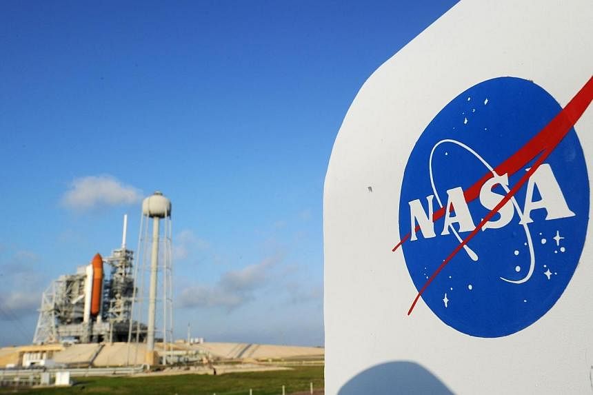 In this April 28, 2011 file photo, the NASA logo on a protective box for a camera near the space shuttle Endeavour at the Kennedy Space Center in Florida.&nbsp;-- PHOTO: AFP