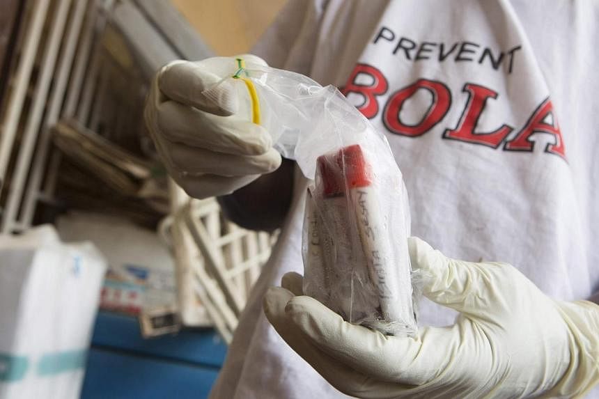 Blood samples from patients suspected of having the Ebola virus disease are prepared for transportation to Freetown for testing, at the Port Loko District Hospital on Sept 27, 2014.&nbsp;-- PHOTO: REUTERS