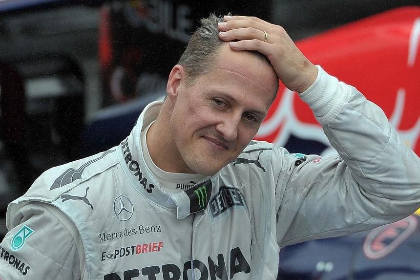 Former Formula One driver Michael Schumacher gesturing at the end of the Brazil's F-1 GP on at the Interlagos racetrack in Sao Paulo, Brazil on Nov 25, 2012. -- PHOTO: AFP