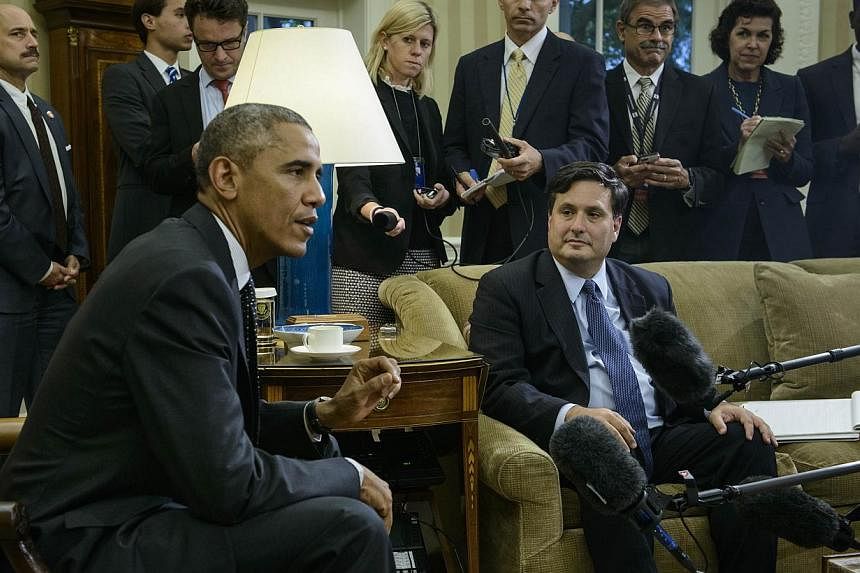 Ebola response coordinator Ron Klain (right) listens while US President Barack Obama makes a statement to the press on the Canadian Parliament shooting after their meeting in the Oval Office of the White House in Washington, DC&nbsp;on Oct 22, 2014. 